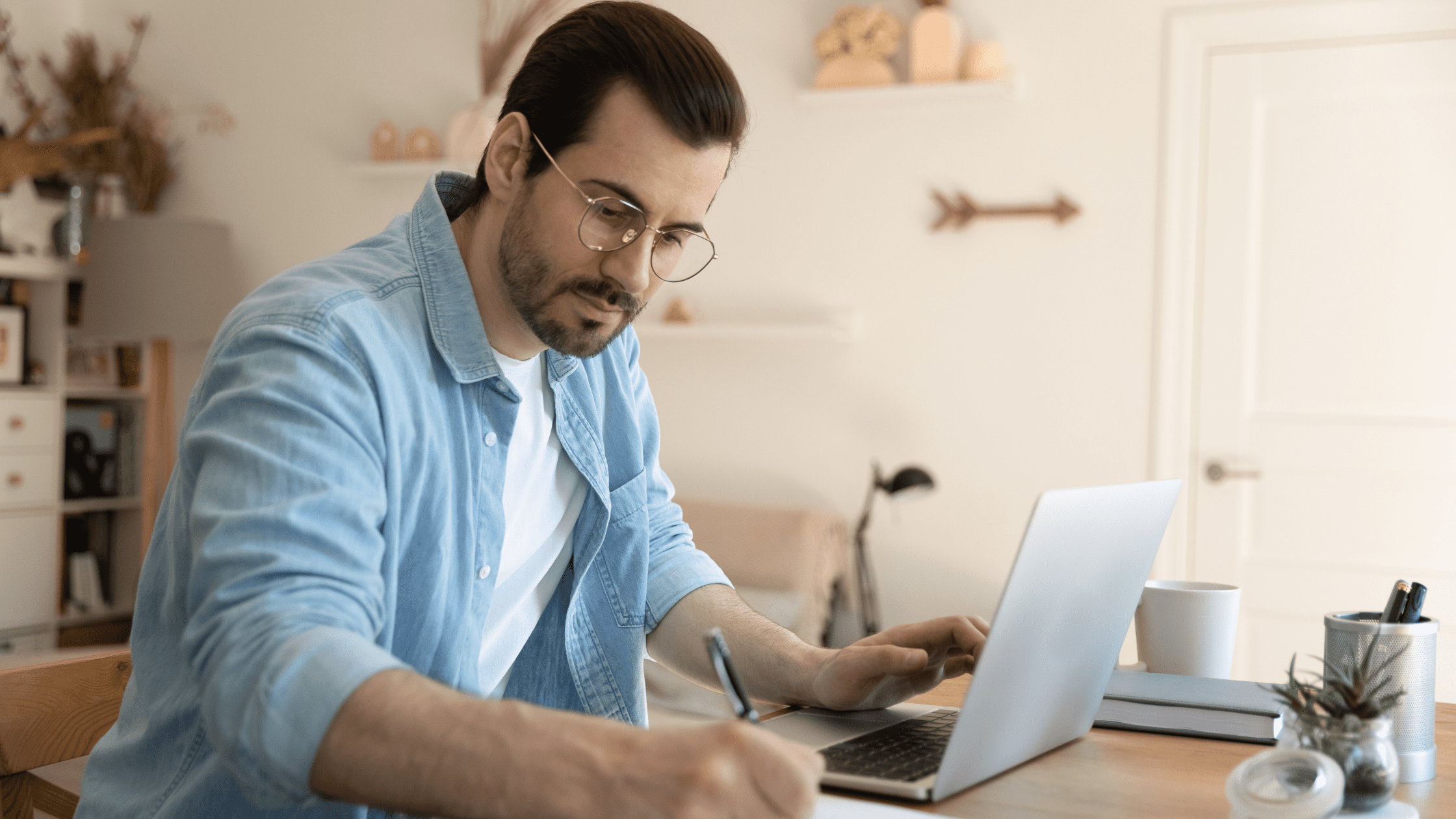 A medical school student studying for the USMLE Step 1 using UWorld flashcards, sitting at a desk in front of a laptop and notebook.